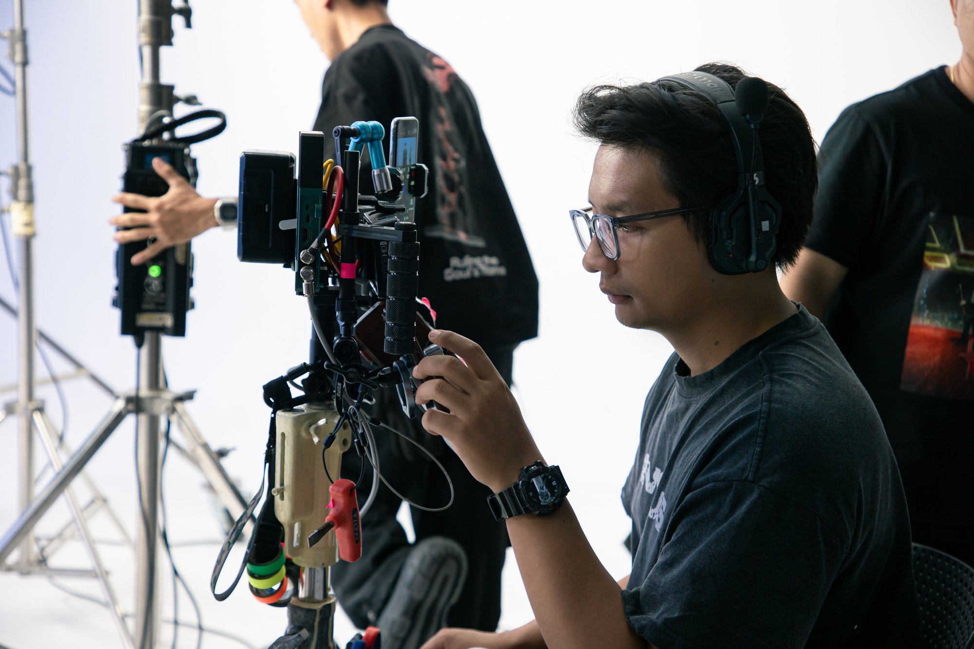 Operator with a rigged camera and monitor, focused